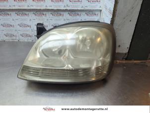 O187396 Gebruikte linker koplamp Nissan Almera Tino
