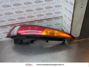 O187439 Gebruikte achterlicht links Nissan Almera Tino