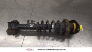 O187883 Gebruikte schokbrekerpoot links-achter Mini ONE