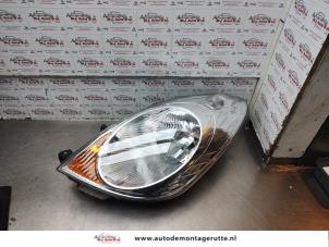 O188103 Gebruikte koplamp links Nissan Note
