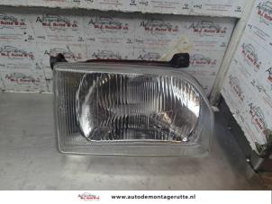 O188243 Gebruikte koplamp rechts Ford Escort