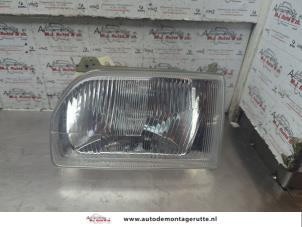 O188244 Gebruikte koplamp links Ford Escort