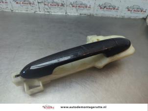 O188579 Gebruikte portiergreep 4deurs links-achter Kia Rio