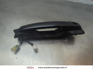 O188986 Gebruikte deurgreep 4deurs links-voor Suzuki Swift