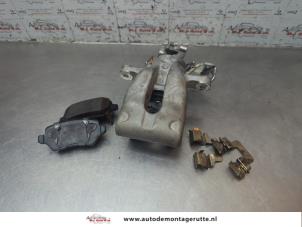 O189089 Gebruikte remklauw (tang) links-achter Opel Astra