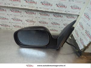 O189523 Gebruikte spiegel buiten links Ssang Yong Rexton
