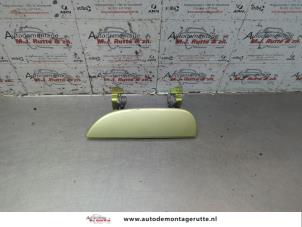 O189631 Gebruikte portiergreep 4deurs links-achter Daihatsu Cuore