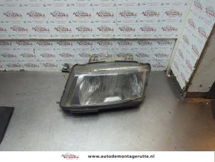 O189906 Gebruikte koplamp links Saab 9-3