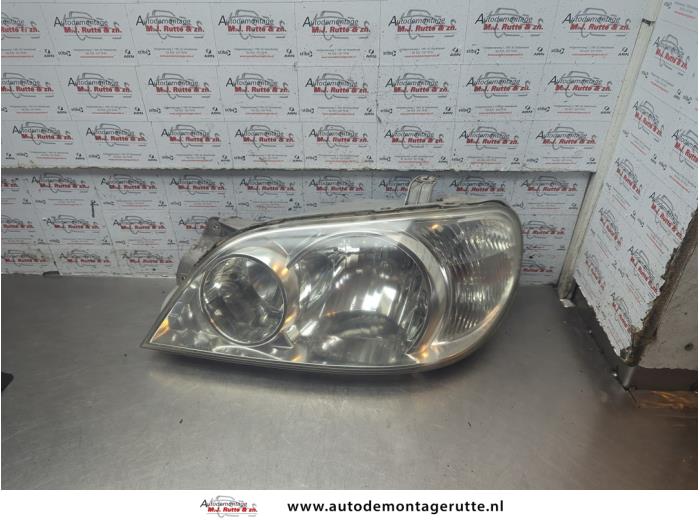 Gebruikte Koplamp links Kia Carnival O190387