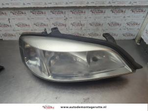 O191915 Gebruikte rechter koplamp Opel Astra