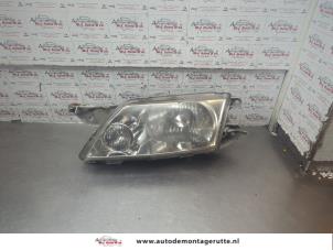 O192105 Gebruikte linker koplamp Mazda Premacy
