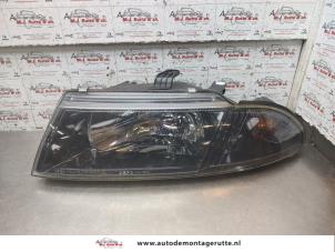 O192646 Gebruikte koplamp links Mitsubishi Carisma