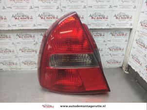 O192647 Gebruikte achterlicht links Mitsubishi Carisma