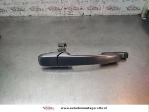 O193383 Gebruikte portiergreep 4deurs links-achter Mazda 5.
