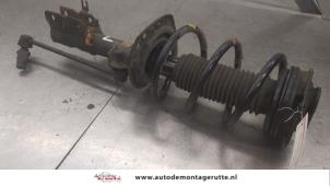 O194253 Gebruikte schokdemperpoot links-voor Nissan X-Trail
