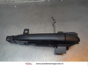 O194664 Gebruikte portiergreep 4deurs rechts-achter Mazda 2.