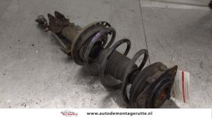 O194724 Gebruikte voorpoot links Renault Clio