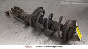 O194725 Gebruikte voorpoot links Renault Clio