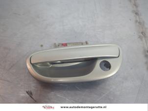 O195040 Gebruikte portiergreep 4deurs links-voor Subaru Outback