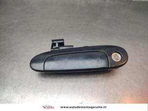 O195318 Gebruikte deurgreep 4deurs links-voor Toyota Yaris
