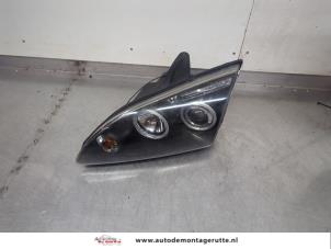 O195616 Gebruikte koplamp links Ford Focus