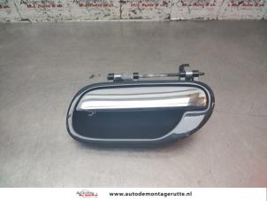 O195821 Gebruikte portiergreep 4deurs links-achter Volvo V40