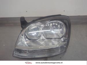 O196087 Gebruikte koplamp links Nissan Almera Tino