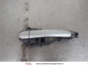 O196331 Gebruikte portiergreep 4deurs links-achter Skoda Octavia