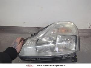 O198639 Gebruikte linker koplamp Renault Modus