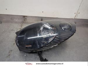 O199008 Gebruikte linker koplamp Nissan Micra