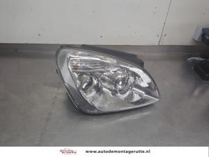 O199871 Gebruikte koplamp rechts Kia Carens