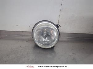 O199916 Gebruikte koplamp links Jeep Cherokee