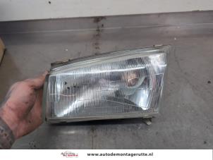 O200119 Gebruikte koplamp links Mazda Demio