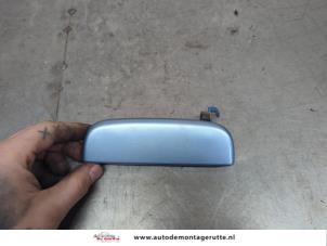 O200139 Gebruikte deurgreep 4deurs links-voor Suzuki Alto