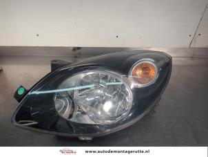O200179 Gebruikte koplamp links Renault Twingo