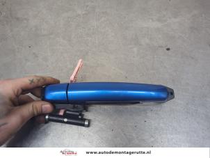 O201112 Gebruikte deurgreep 4deurs links-achter Opel Agila