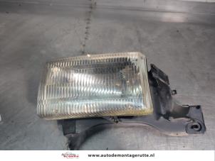 O201258 Gebruikte koplamp links Dodge RAM