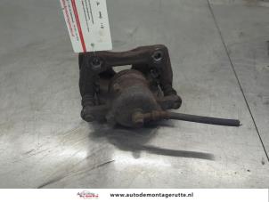 O202398 Gebruikte remklauw (tang) links-voor Nissan Micra