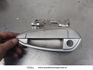 O203899 Gebruikte portiergreep 4deurs links-voor Fiat Punto