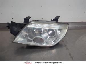 O203936 Gebruikte linker koplamp Mitsubishi Outlander