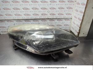 O204002 Gebruikte koplamp rechts Renault Scenic