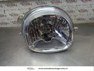 O205035 Gebruikte koplamp rechts Renault Twingo