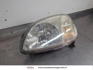 O205074 Gebruikte koplamp links Honda Logo