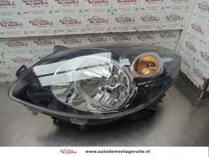 O205264 Gebruikte koplamp links Renault Twingo