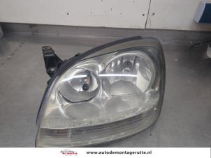O205503 Gebruikte linker koplamp Nissan Almera Tino