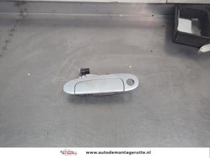 O206303 Gebruikte portiergreep 2deurs links Toyota Yaris