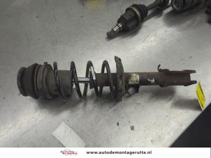 O206909 Gebruikte schokdemperpoot rechts-voor Opel Corsa