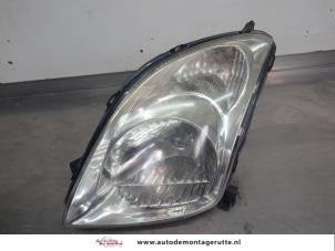 O207010 Gebruikte linker koplamp Suzuki Swift