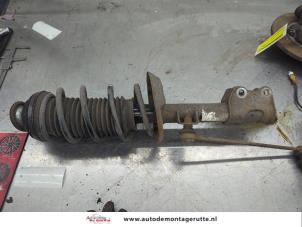 O207036 Gebruikte schokdemperpoot rechts-voor Opel Corsa