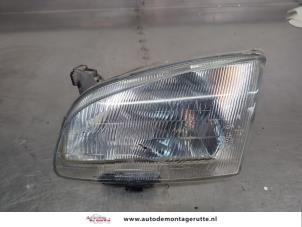 O207437 Gebruikte koplamp links Toyota Starlet